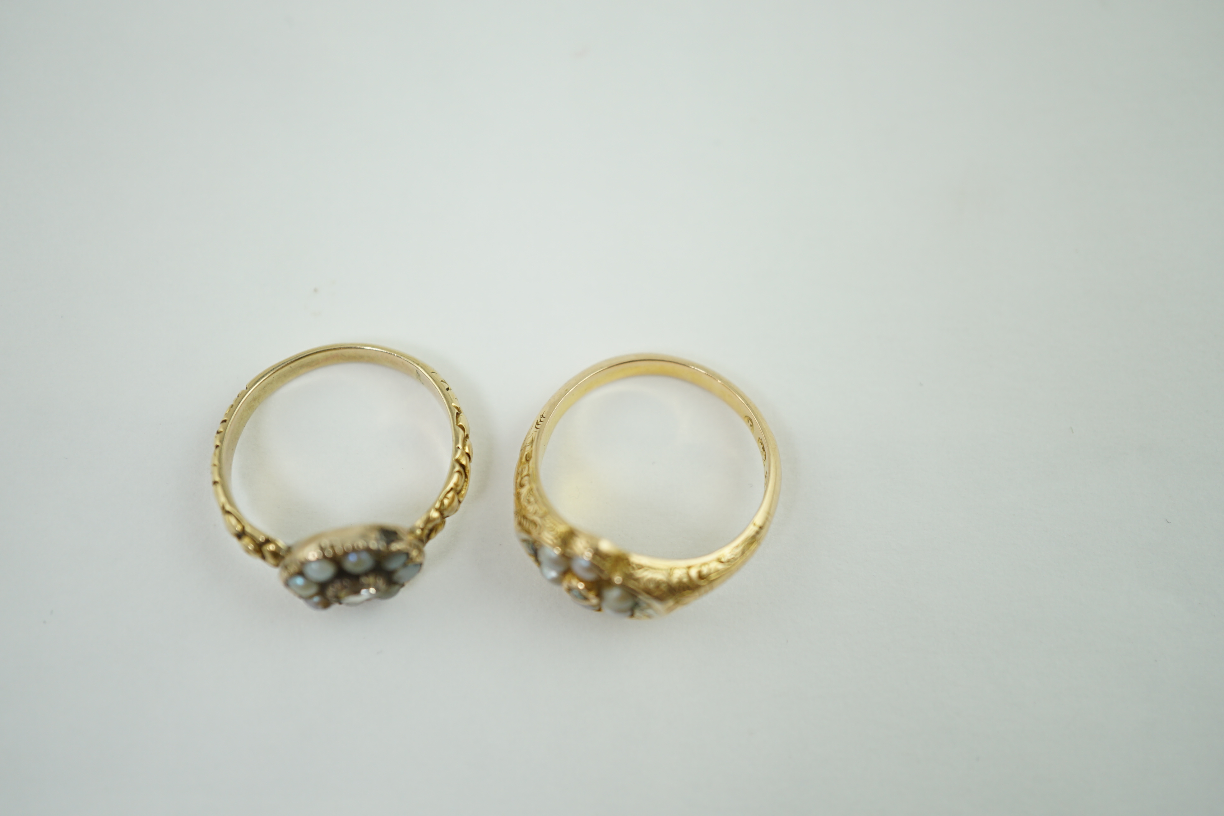 A late Victorian 15ct gold, rose cut diamond and split pearl cluster set ring, size L and one other similar unmarked gold ring